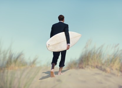 Businessman with surfboard 414x300